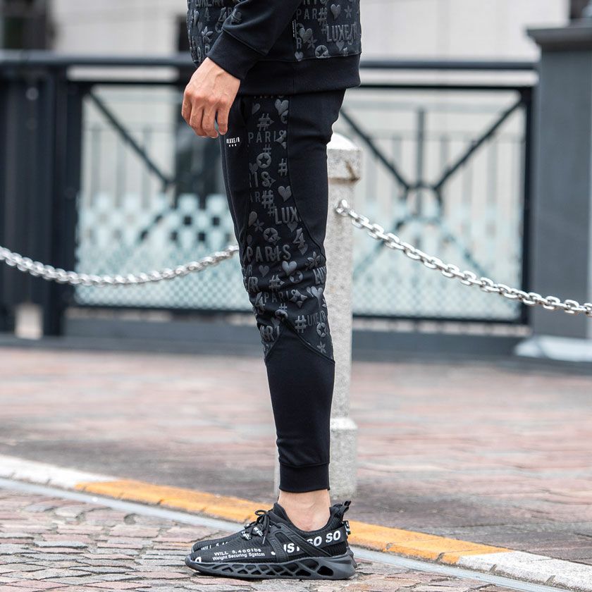 スウェットパンツ メンズ LUXE／R(ラグジュ)切り替え総柄ロゴジョガー